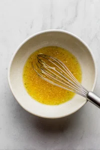 Pour dressing over the fruit salad and toss gently to coat