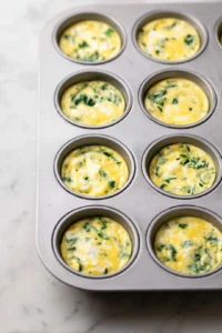 Pour the mixture evenly into the muffin tin