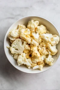 Spread cauliflower florets on baking sheet and bake until tender