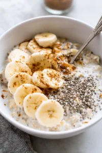 Stir the oats and top with sliced bananas, chia seeds, and cinnamon