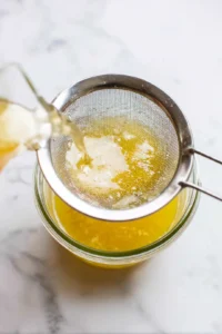 Strain the mixture and add lemon juice