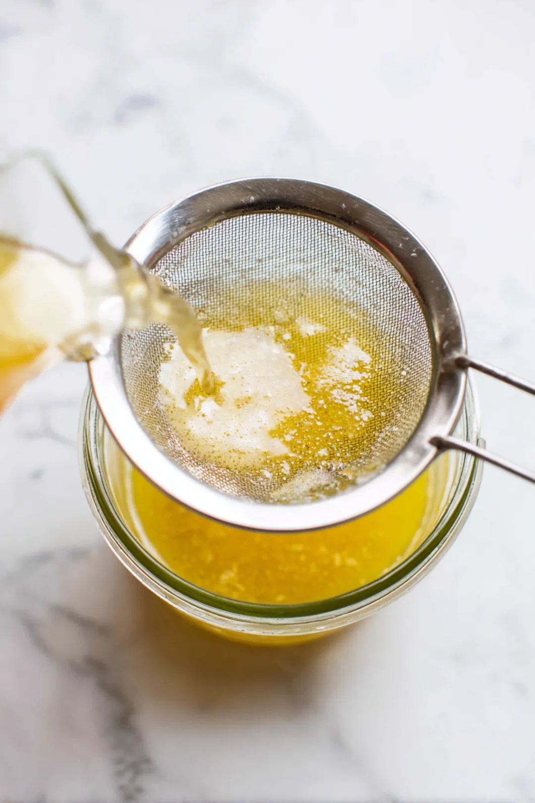 Strain the mixture and add lemon juice