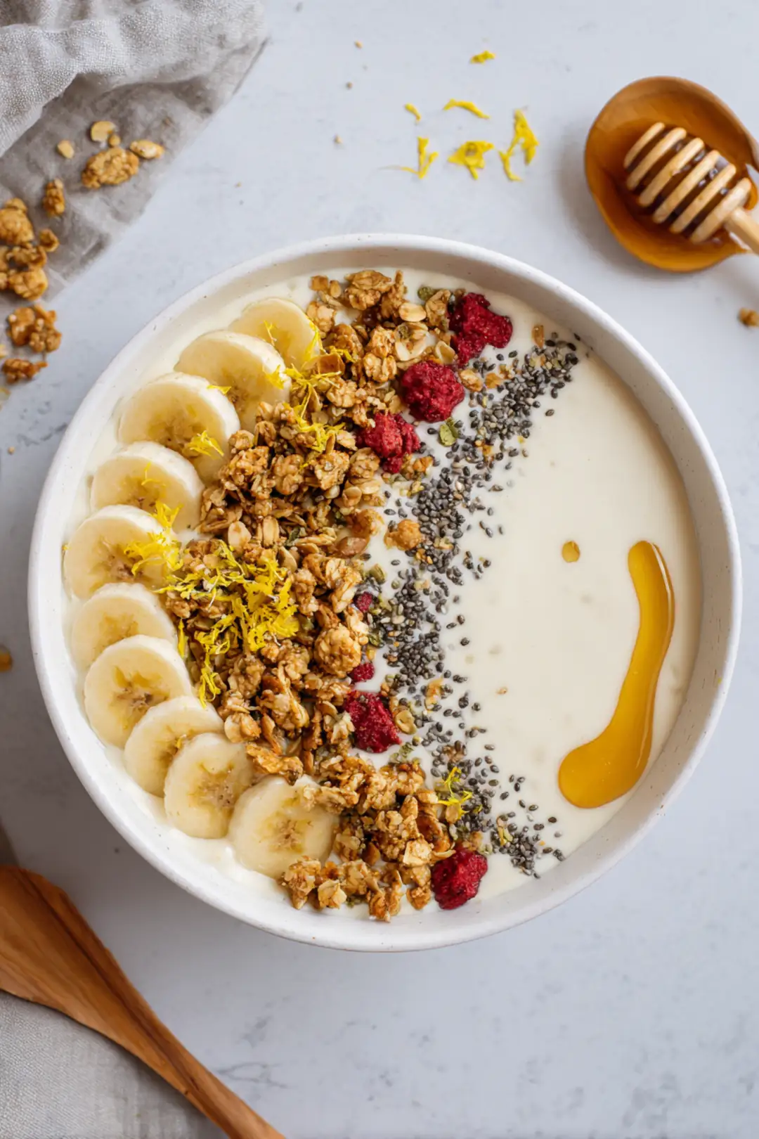 Top with lemon zest, granola, chia seeds, and a drizzle of honey for added sweetness
