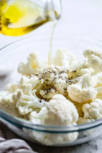 Toss cauliflower florets with olive oil, salt, and black pepper