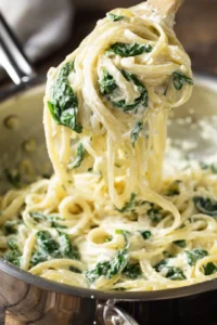 Toss pasta with ricotta sauce and spinach