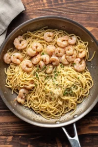 Transfer the cooked pasta and shrimp mixture to a baking dish and sprinkle with cheese, then bake until bubbly and golden