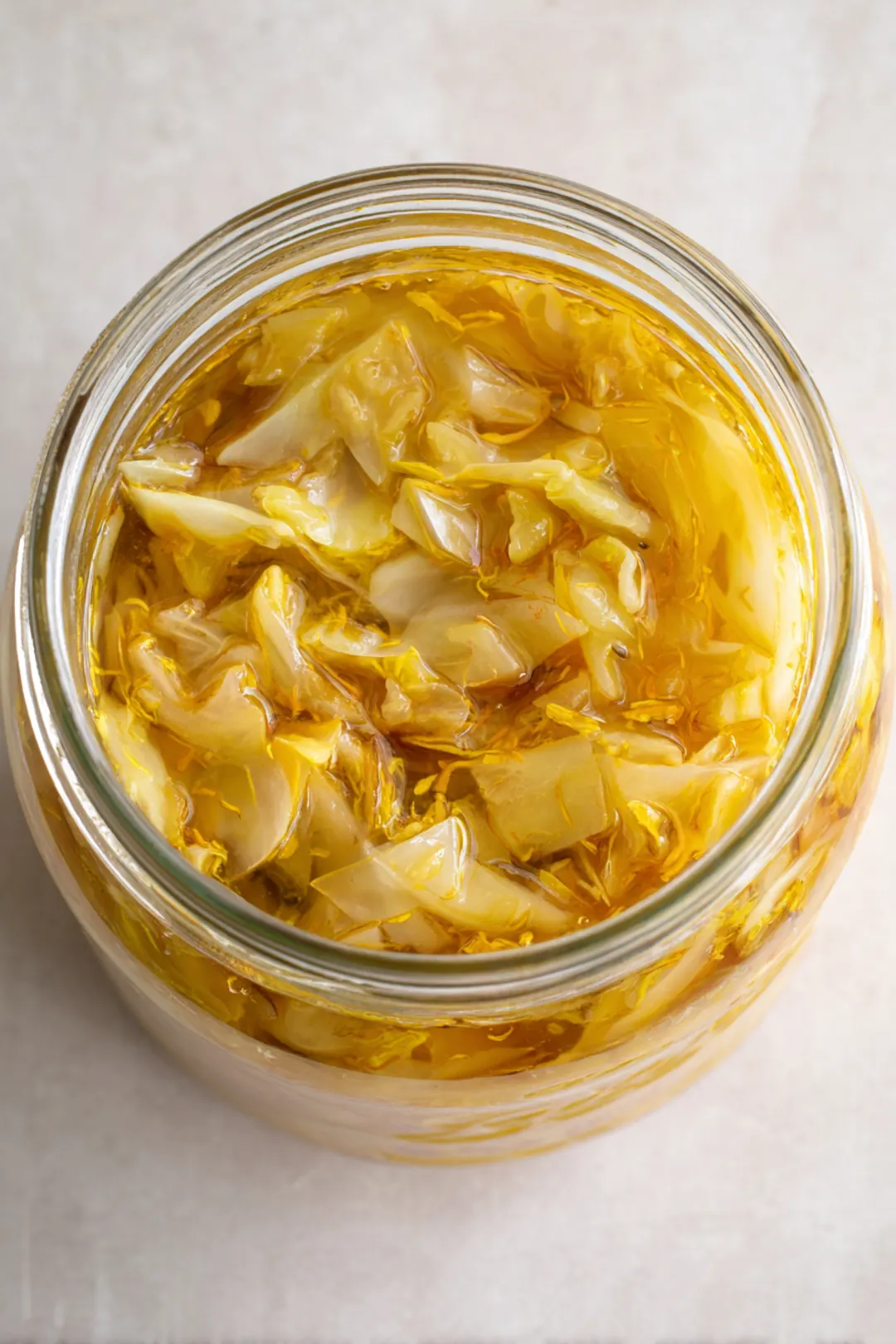 Transfer the mixture into a clean jar and press it down firmly so that the liquid covers the cabbage and apples. Seal the jar with a lid and let it ferment at room temperature for 3 days.