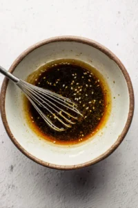 Whisk together miso paste, rice vinegar, sesame oil, and soy sauce until smooth