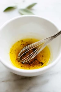 Whisk together olive oil, balsamic vinegar, and honey to create the dressing